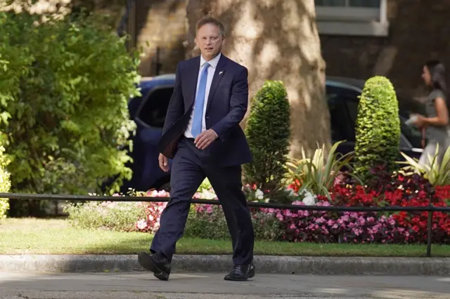 Grant Shapps walks up Downing Street