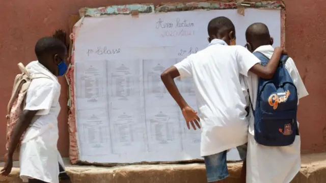 students gather in the courtyard ahead of the reopening of the school after a closure of 11 months on account of the Covid-19 pandemic in Luanda - February 2021