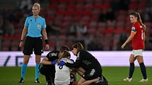A photo of Simone Magill receivng treatment