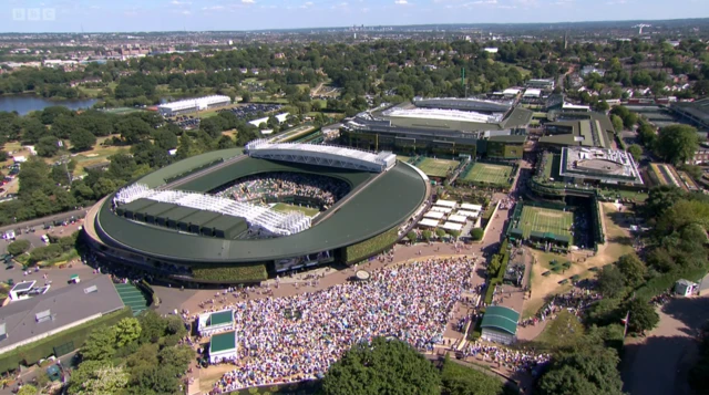 An overhead shot of the hill at Wimbledon full of people