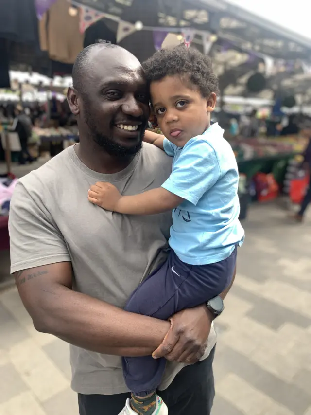 Ade Williams and his son Tayo in Wolverhampton market