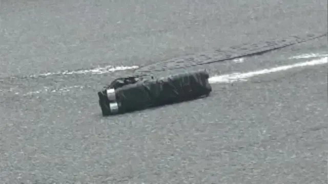 Picture shows a gun that looks homemade with black tape wrapped around two barrels