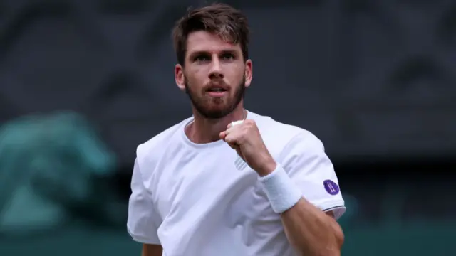 Cameron Norrie pumps his fist in celebration