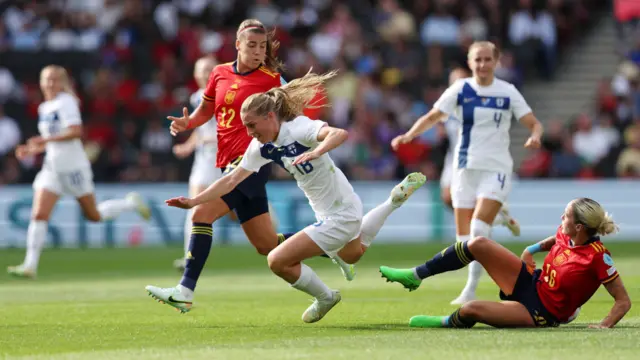 Linda Sallstrom of Finland is challenged by Patri Guijarro and Mapi Leon