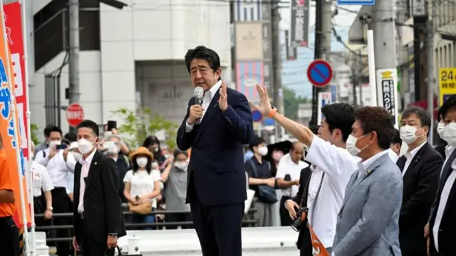 Japanese Prime Minister Shinzo Abe makes a speech before he was shot from behind by a man in Nara, western Japan July 8, 2022