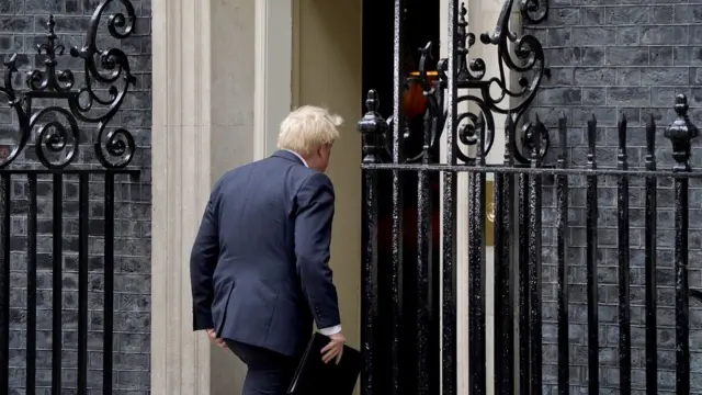 Boris Johnson walks into Downing Street