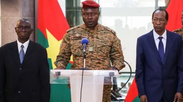 Lieutenant-Colonel Paul-Henri Sandaogo Damiba flanked by Blaise Compaoré (R) and Jean-Baptist Ouédraogo (L)