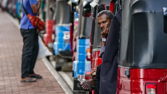 Man in tuk tuk