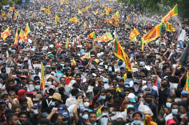 People attend an anti government protest rally, calling for the resignation of the president over the alleged failure to address the economic crisis, near the President's house in Colombo, Sri Lanka, 09 July 2022.