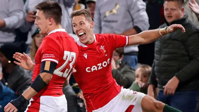 Josh Adams and Liam Williams celebrate