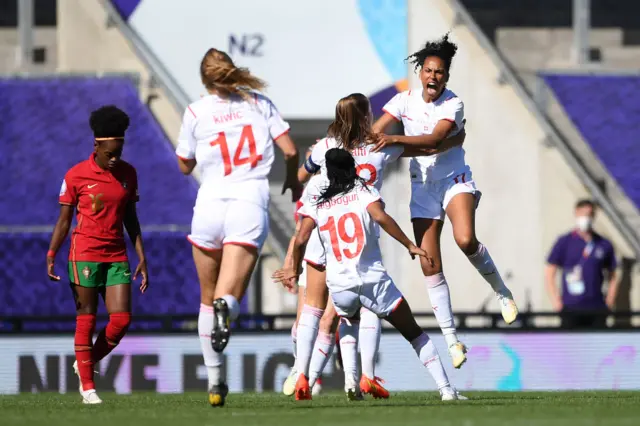 Coumba Sow of Switzerland celebrates with teammatesafter scoring their team's first goal