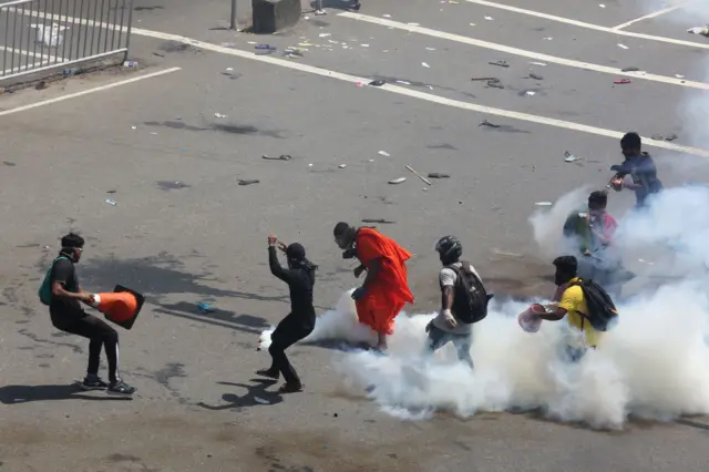 Security forces fire tear gas to disperse an anti government protest rally, calling for the resignation of the president over the alleged failure to address the economic crisis, near the President's house in Colombo, Sri Lanka, 09 July 2022.