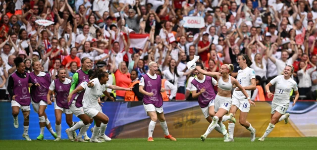 Chloe Kelly celebrates scoring for England in the Euro 2022 final