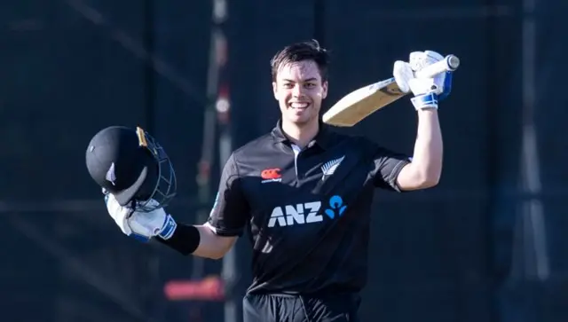 Ian Jacobs celebrates reaching 100 not out in the Edinburgh sunshine