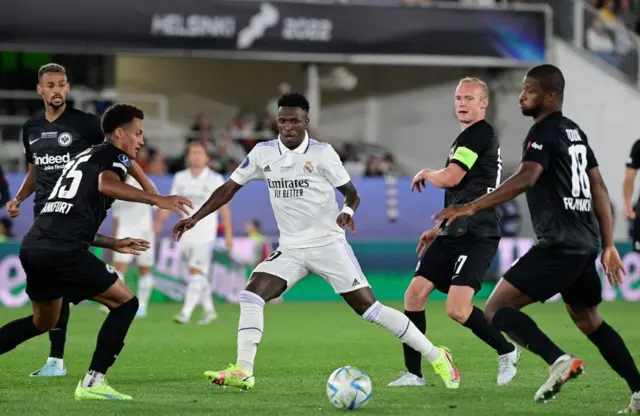 Real Madrid's Brazilian forward Vinicius Junior and Frankfurt's German midfielder Sebastian Rode