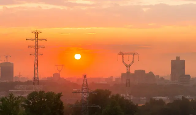 Sunset over electricity grids in Ghana