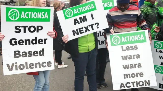 Protesters with placards against gender based violence in South Africa