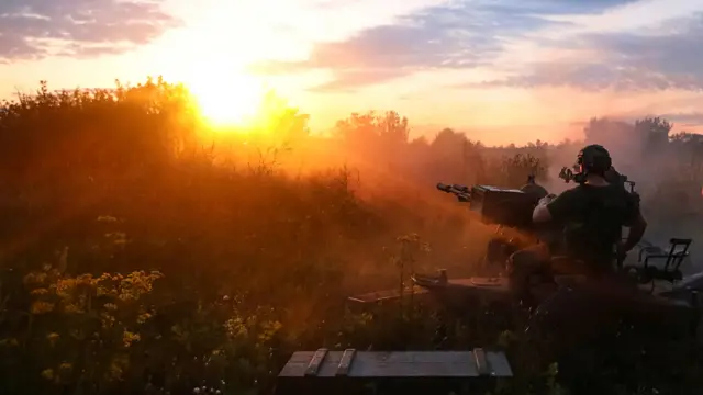 A Ukrainian serviceman with a ZU-23-2 anti-aircraft cannon near a front line in Kharkiv region