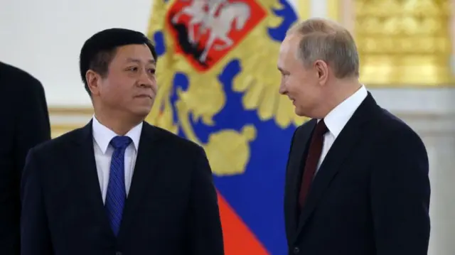 Zhang Hanhui and Putin in 2020