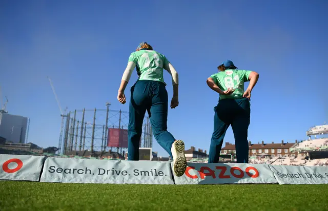 Sophia Smale and Dane van Niekerk taking to the field