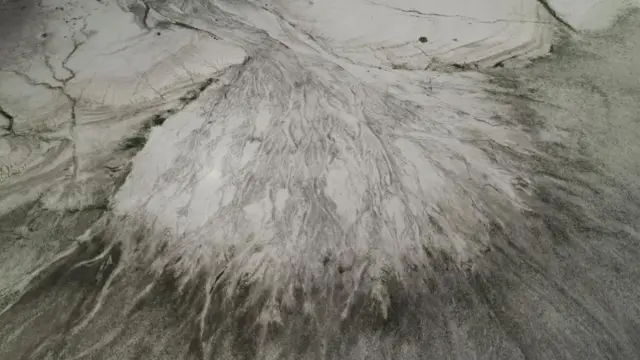 A picture taken with a drone shows the tail of the Yesa reservoir with the Aragon river practically without water in Yesa, Navarra, Spain, 11 August 2022