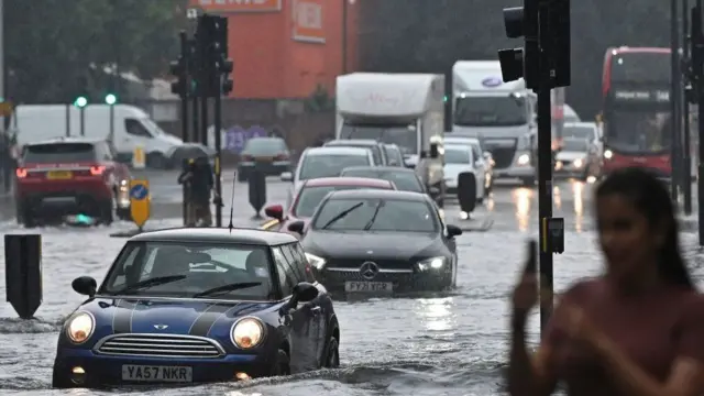 Buses and cars were left stranded when roads across London flooded in July 2021