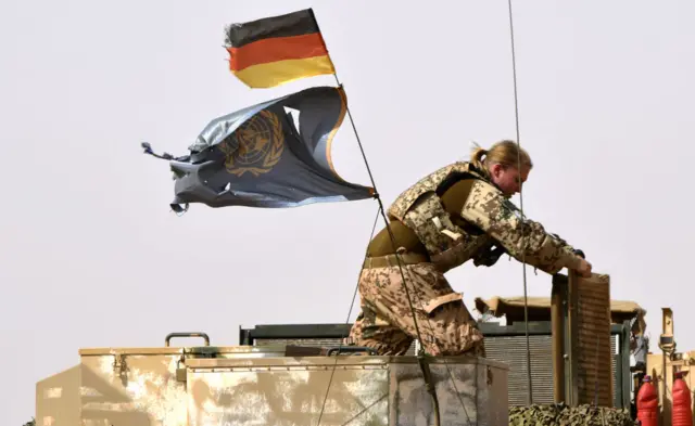 A German soldier from the parachutists detachment of the MINUSMA (United Nations Multidimensional Integrated Stabilization Mission in Mali) search for IED (improvised explosive device) during a patrol on the route from Gao to Gossi, Mali on August 2, 2018.