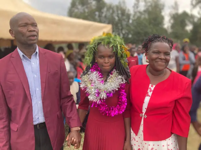 Linet Chepkorir with her parents