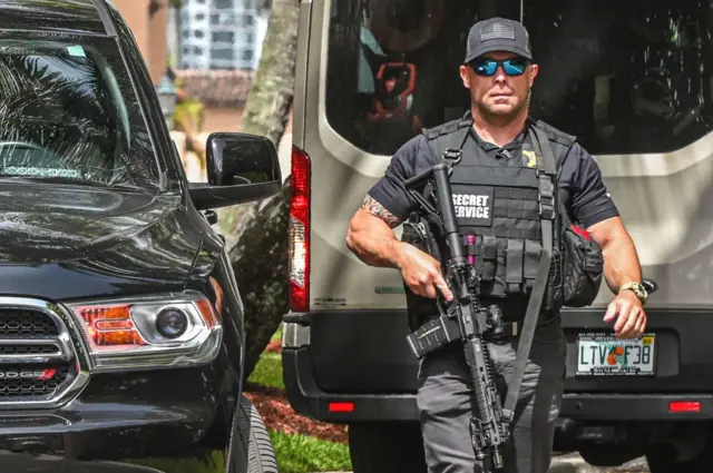 A US Secret Service agent outside Mar-a-Lago one day after the raid