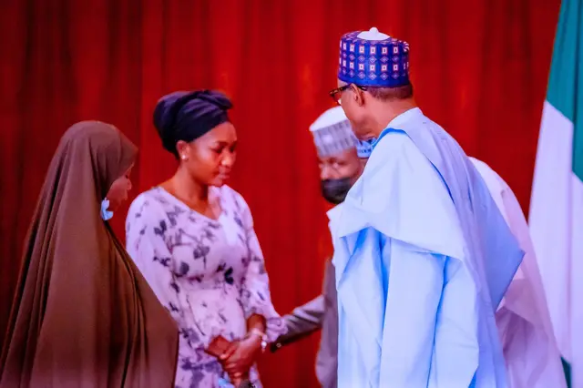 President Muhammadu Buhari with families of hostages