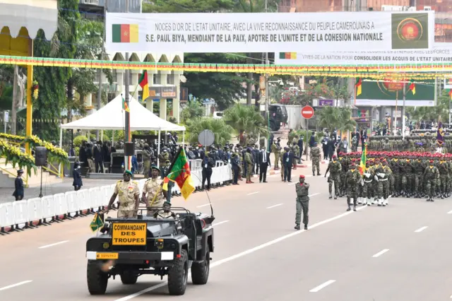 Cameroonian troops march during a parade in Yaounde on May 20, 2022.