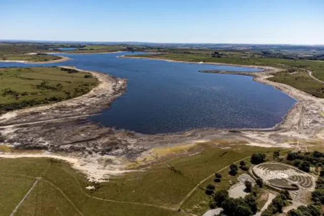 Colliford Lake where water levels have severely dropped exposing the unseen trees and rocks at Cornwall's largest lake and reservoir, covering more than 900 acres of Bodmin Moor, Cornwall.