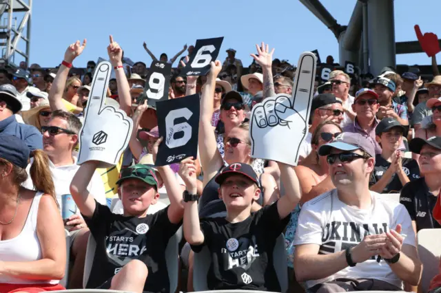 Fans in the crowd celebrating a six at The Hundred