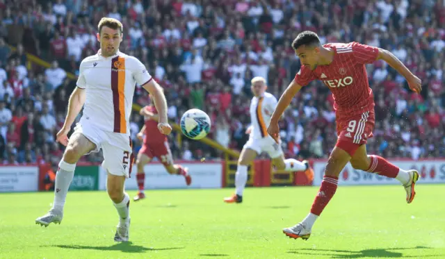 Bojan Miovski lobs the ball over Liam Kelly, but it's also over the bar