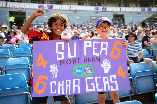 Two young male fans at the Northern Superchargers v London Spirit game in The Hundred