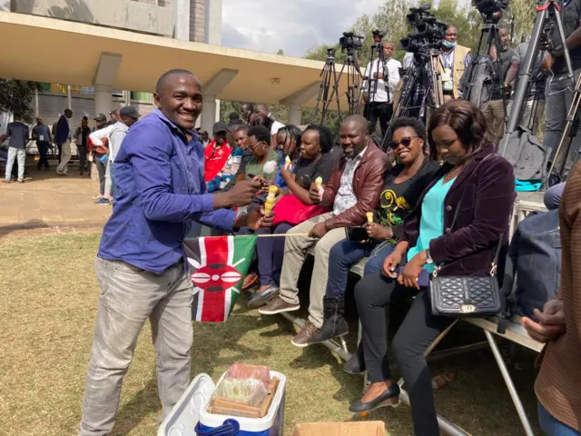 A snack vendors sells ice cream at Bomas of Kenya.