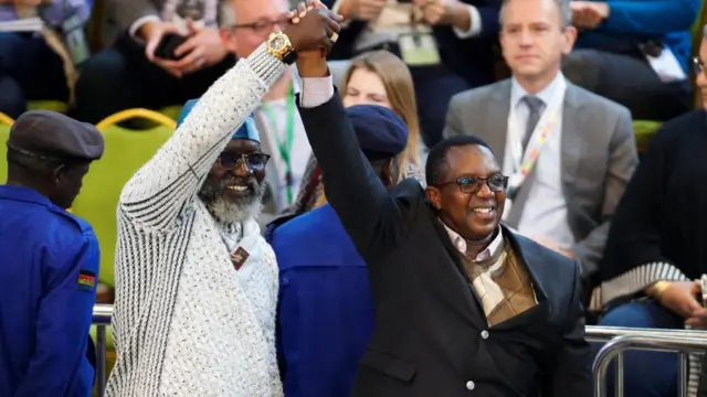 Kenyan presidential candidates George Wajackoyah of the Roots Party and David Mwaure of the Agano Party arrive at the IEBC National Tallying Centre at the Bomas of Kenya, in Nairobi, Kenya August 15, 2022