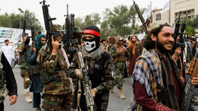 Taliban fighters take to the streets to mark the first anniversary of the fall of Kabul