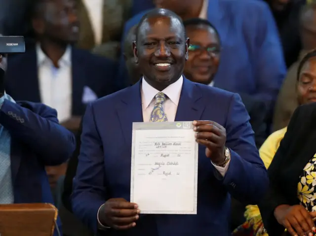 Kenya's Deputy President William Ruto and presidential candidate for the United Democratic Alliance (UDA) and Kenya Kwanza political coalition reacts after being declared the winner of Kenya's presidential election