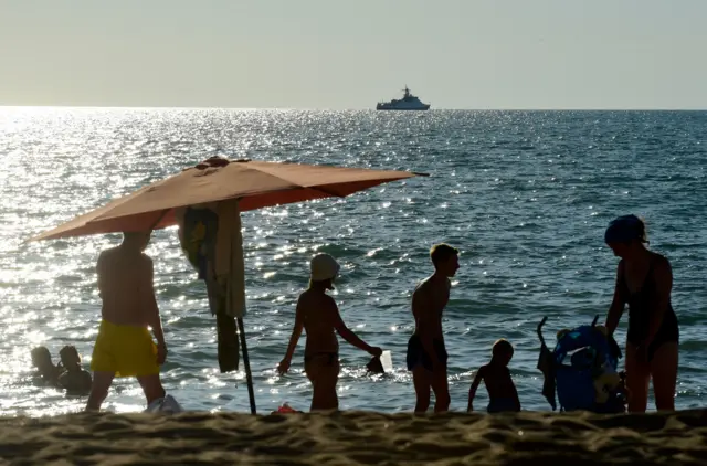 People relaxing on a beach in Crimea