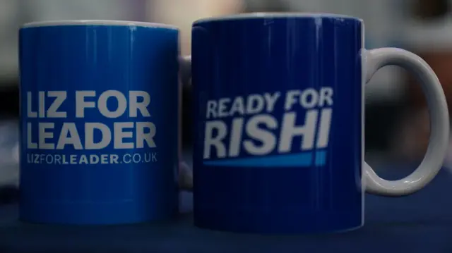 the candidates' campaign logos on blue mugs