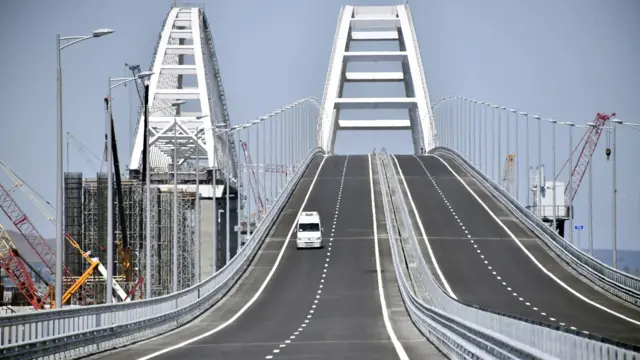 A vehicle runs down the Crimean Bridge