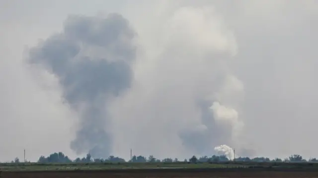 A view shows smoke rising above the area following an alleged explosion in the village of Mayskoye in the Dzhankoi district, Crimea,