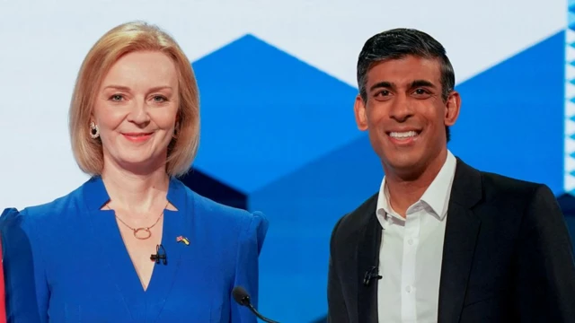 Liz Truss and Rishi Sunak smile at a previous leadership event