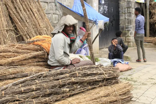 Man holding sticks