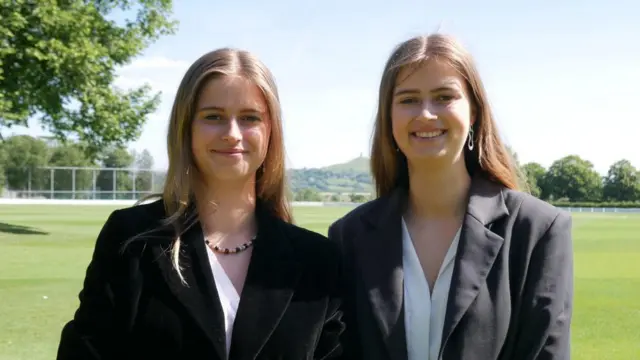 Twin sisters Elena and Rosa Launder pose for a photo