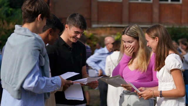 A-level students react to their results at Norwich School in Norfolk