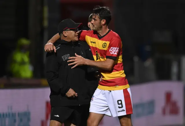 Ian McCall and Brian Graham embrace