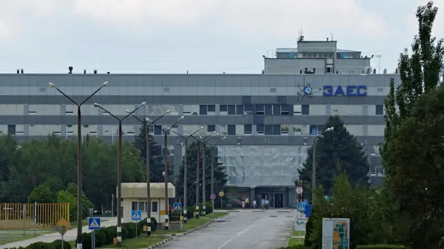 View of building at Zaporizhzhia nuclear plant, Ukraine, with logo on side, 4 August 2022