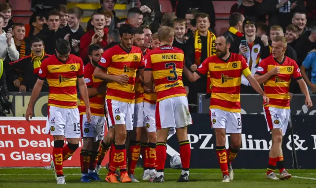 Partick players celebrate the third goal